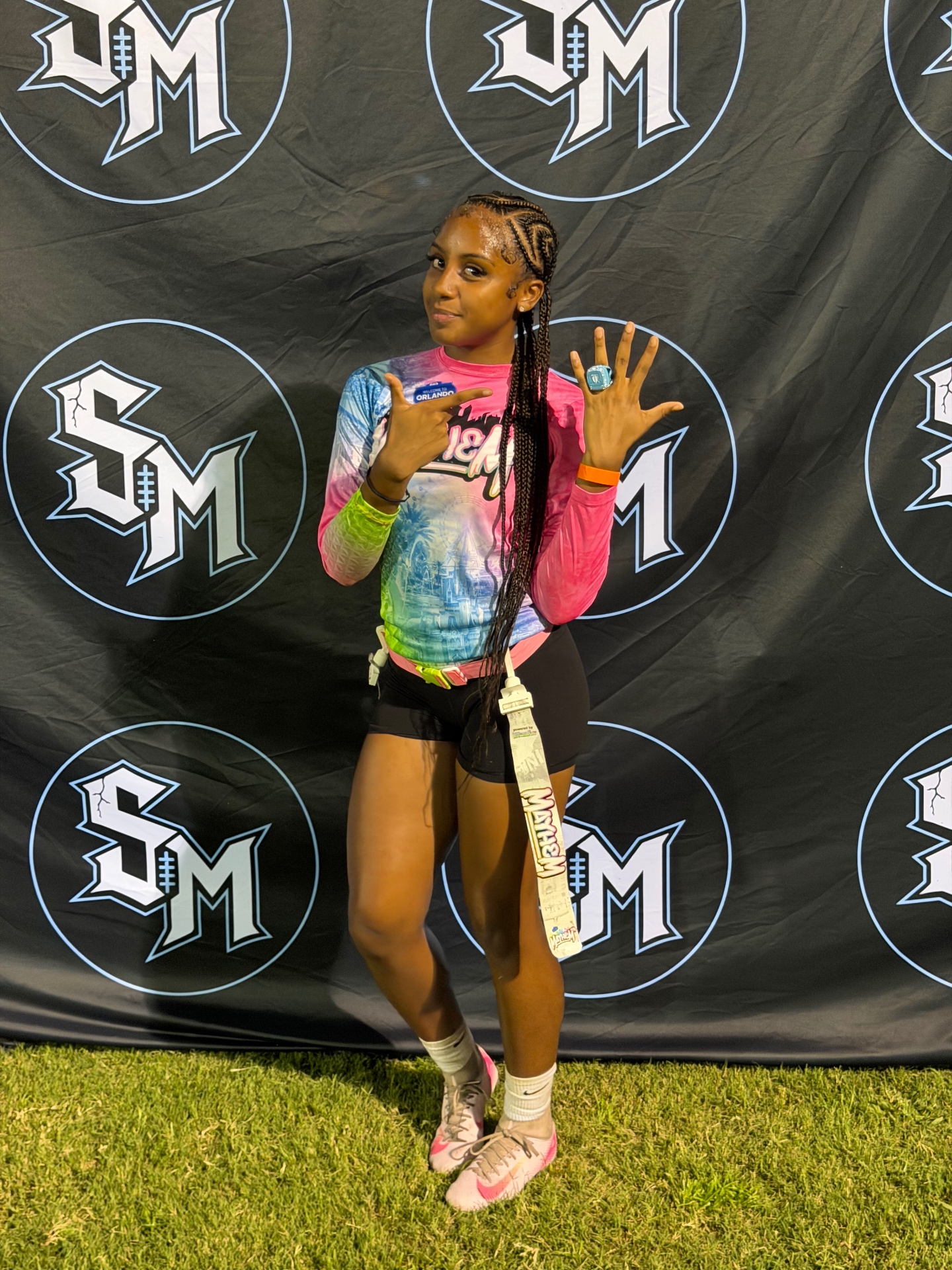 Young athlete proudly showing a championship ring